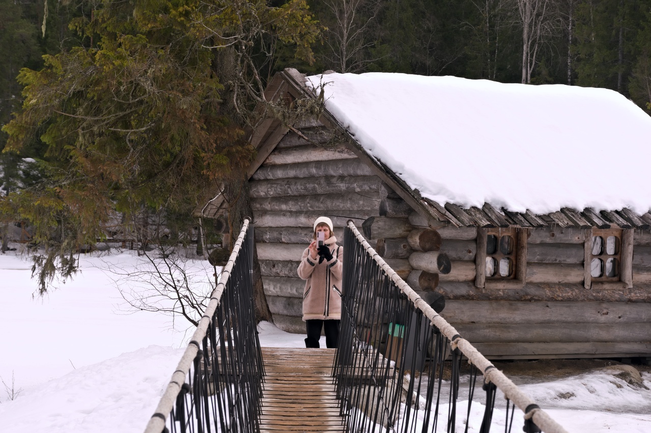 Making picture near a hut