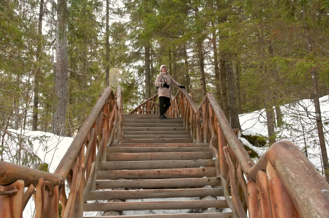 Woman on a wooden staircase