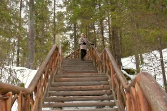 Woman on a wooden staircase